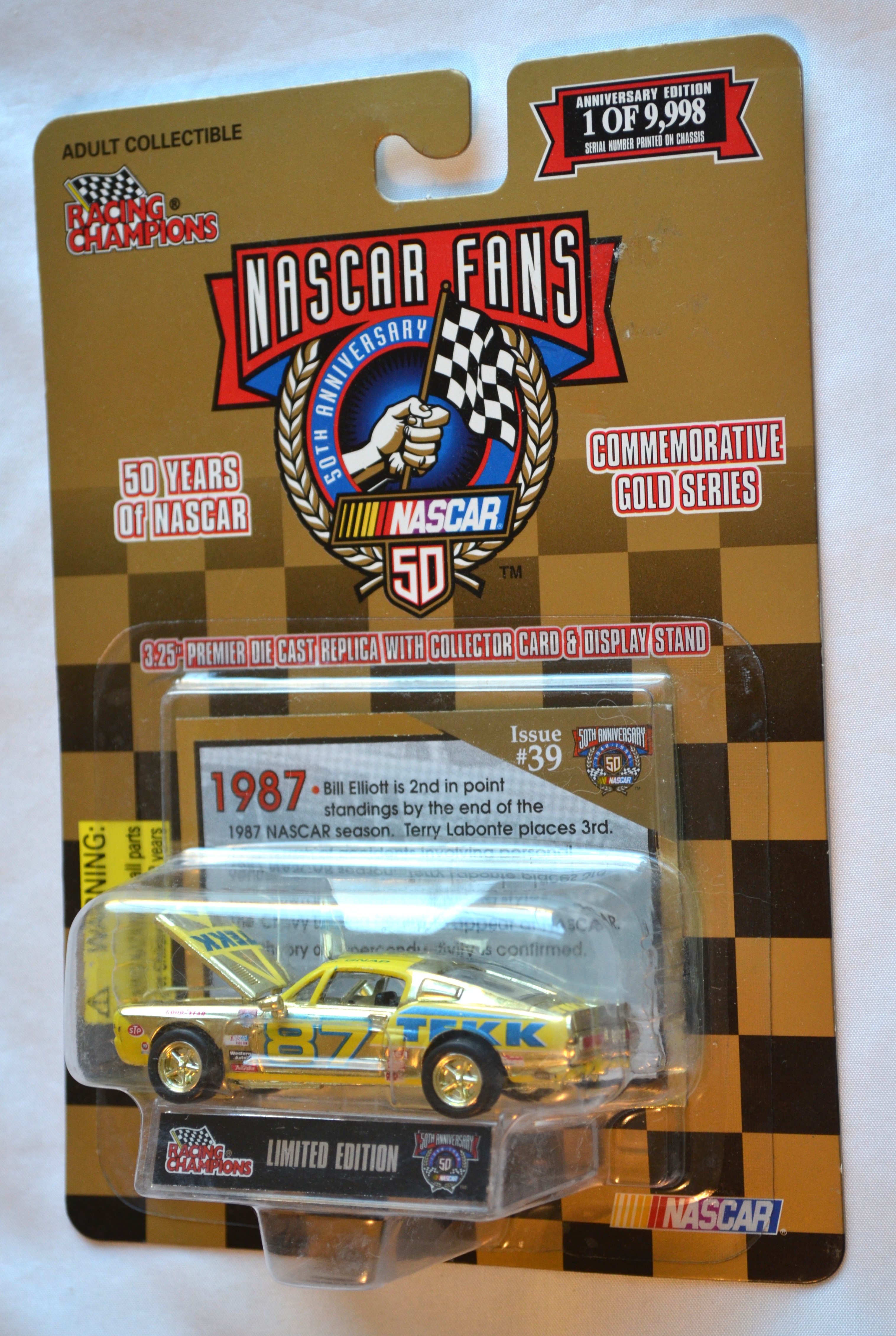 Racing Champions 39 - NASCAR50TH 87 Mustang Gold 1/9998