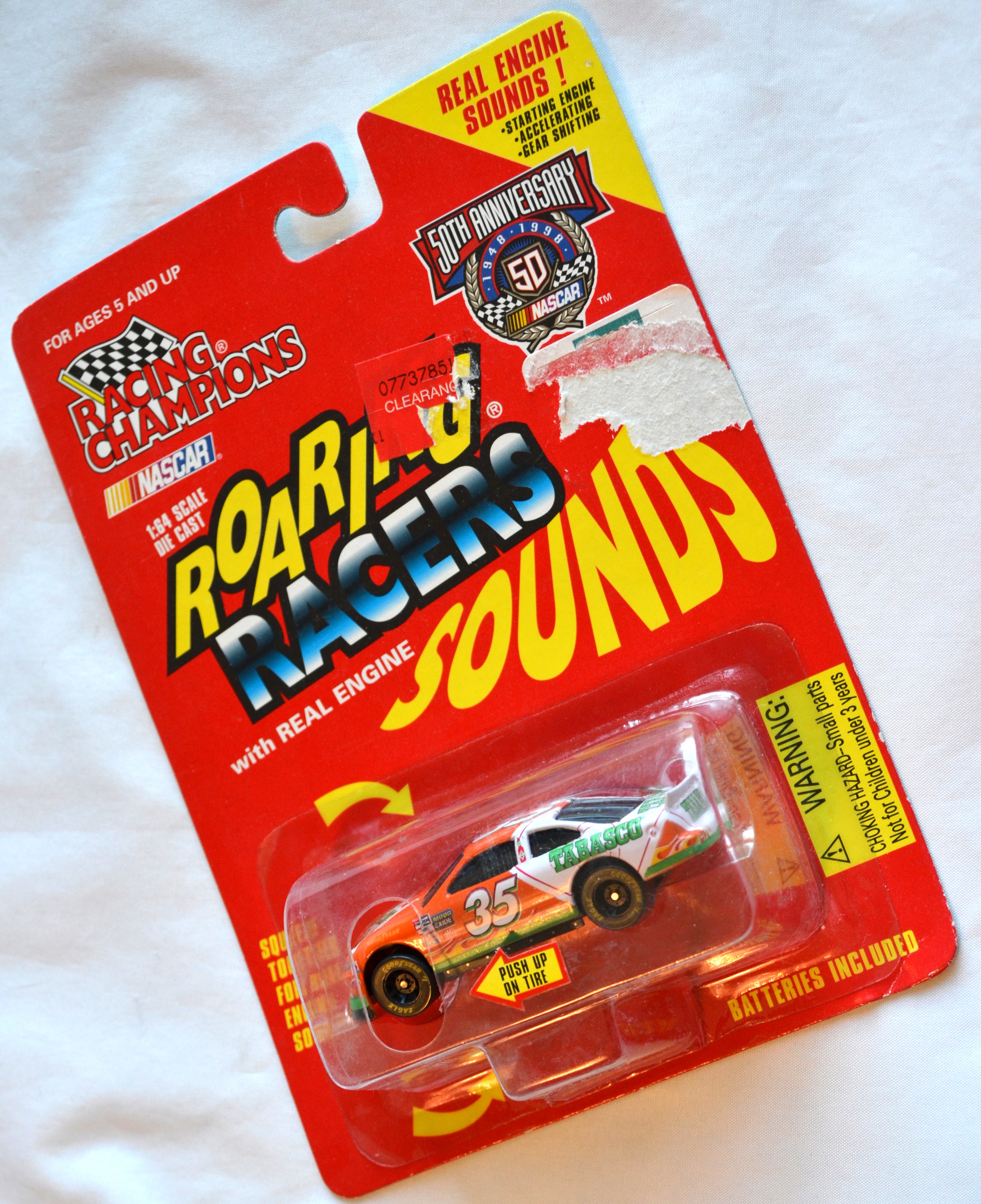 Racing Champions - ROARINGSOUNDS Tabasco 35 Orange and White C8.5 card